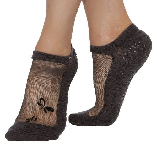 grip socks for pilates yoga barre and reformer with mesh and dragonfly pattern on the upper part of the footof foot