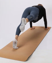 Charger l'image dans la galerie, grip socks in white silver on feet at doing pilates workout