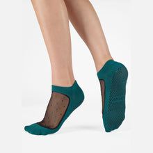 Cargar imagen en el visor de la galería, Teal socks with non-slip sole worn by a person on a white background
