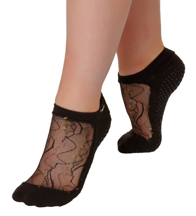 grip socks with mesh with intertwined tendrils of wavy gold and black