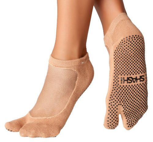 Grip socks with separate toes in nude color and mesh on the upper part of feet